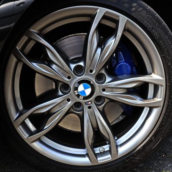 Diamond-cut alloy wheel with a smooth, shiny metallic finish showcasing high-precision craftsmanship, perfect for vehicle enhancement